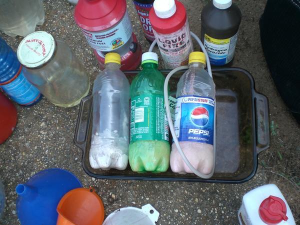 Several soda bottles and other chemicals used to make meth.