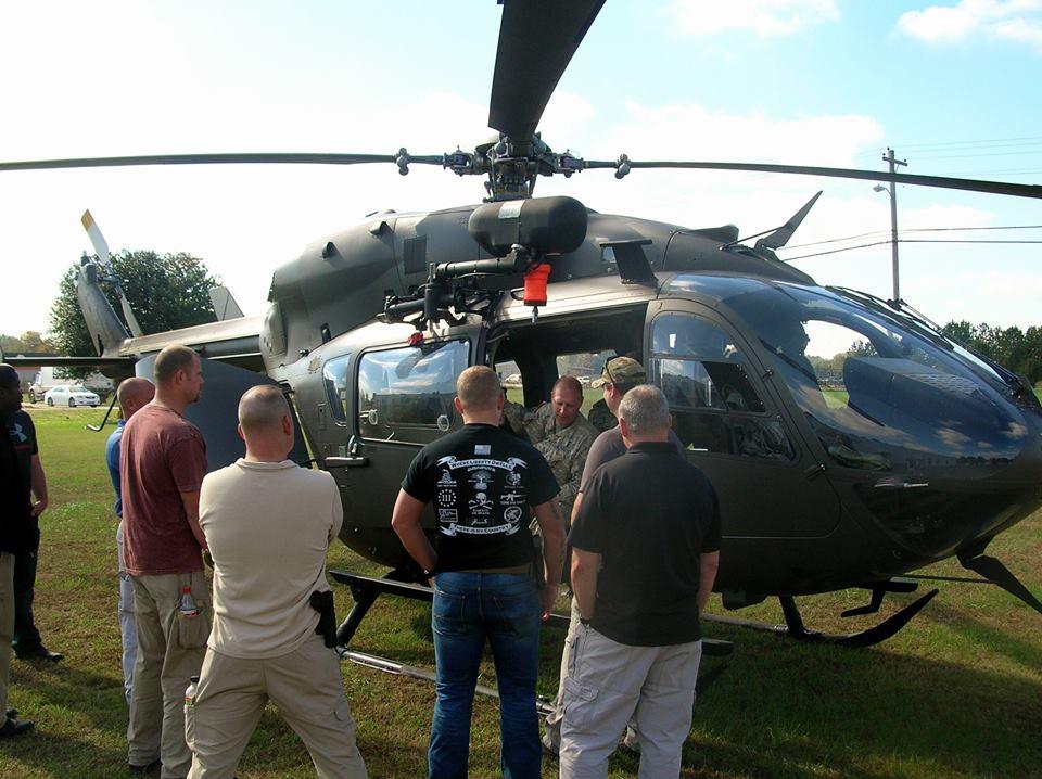 Members of the Sheriff's Office being trained by a member of the National Guard.